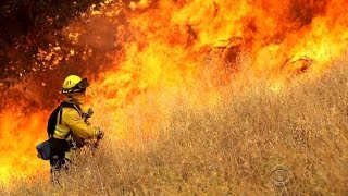 High heat and dry winds fuel wildfires