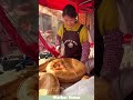 Junan Da Bing, made from flour, water, salt dough, rolled into thick discs and baked.