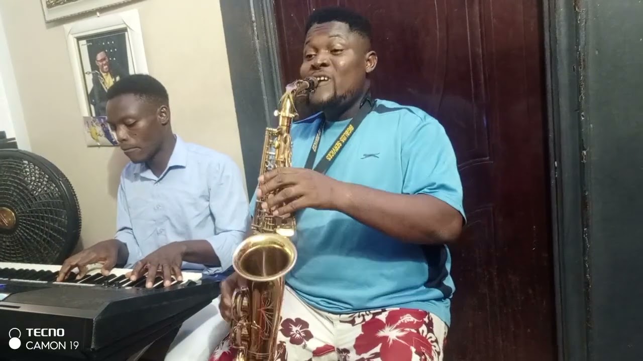 MINISTER BIGDADDY AND LEO. OH COME OH  YE FAITHFUL. OH COME LET US ADORE HIM.