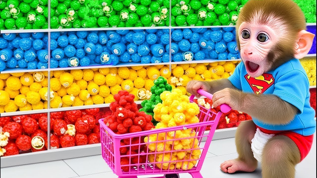 Mono Bon Bon está feliz bajo una lluvia de palomitas de maíz arcoíris y cuida a los patitos