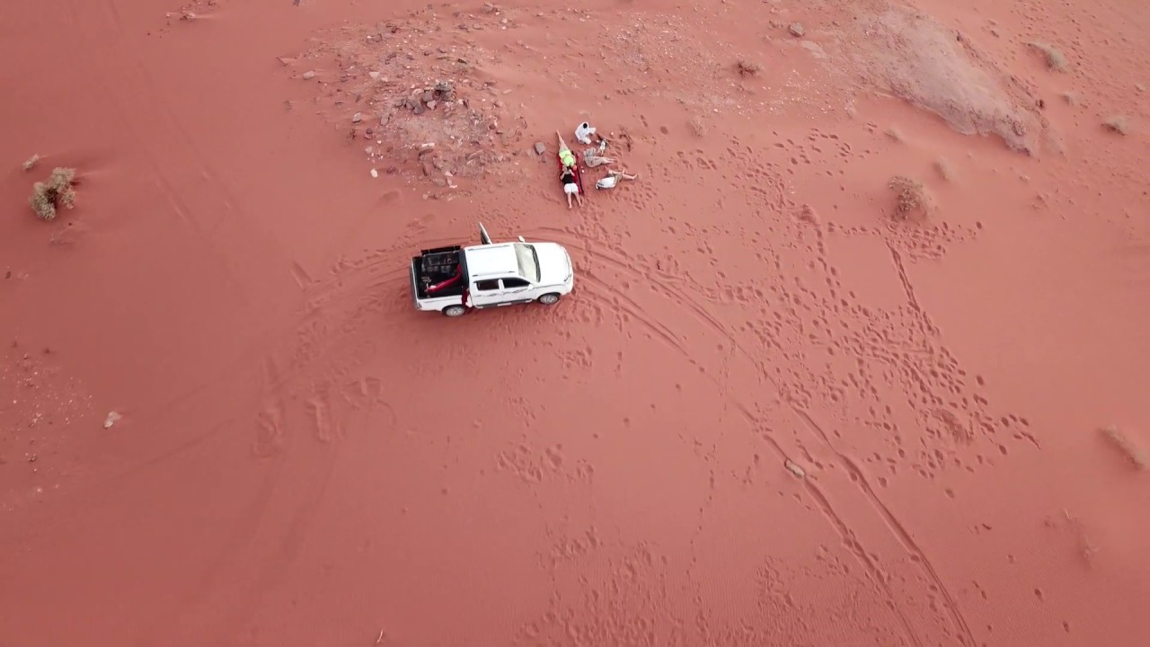 Smoking shisha under the sun in the desert at Wadi Rum Camp and Tours