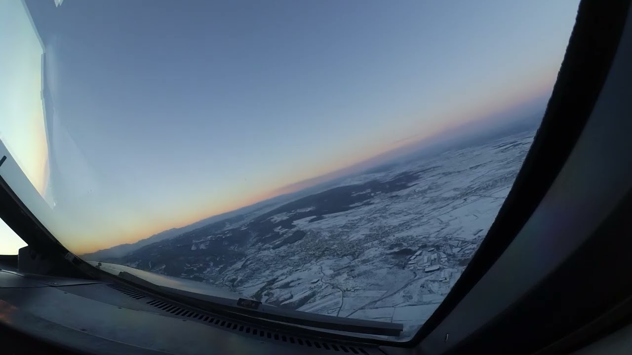 Stunning approach and landing in Pristina, Kosovo. A320, snow and sunset!