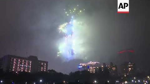 Crowds cheer NYE fireworks at Taipei 101 Tower