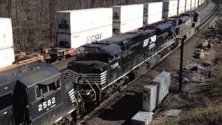 A Roaring All EMD NS Eastbound Oil Tank Train 64R Meets a Stack Train at Cassandra