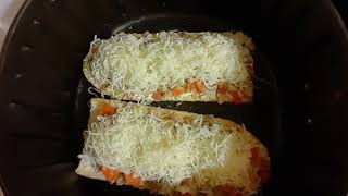 Air Fryer Stouffer's French Bread Pizza hooked up with extra cheese.