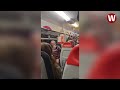 The brilliant moment an entire train carriage broke out into Christmas songs together