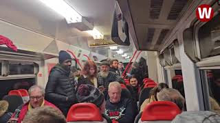The brilliant moment an entire train carriage broke out into Christmas songs together