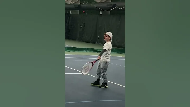 The kid loves tennis
