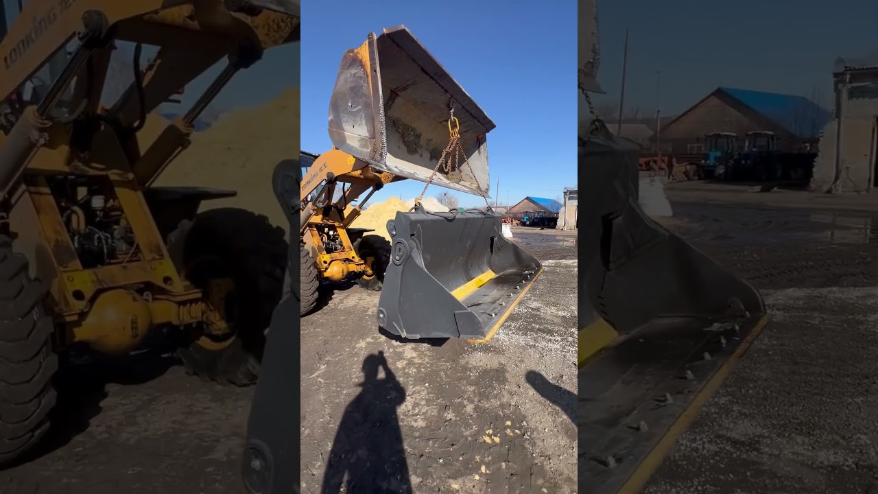 Фронтальный погрузчик с челюстным ковшом