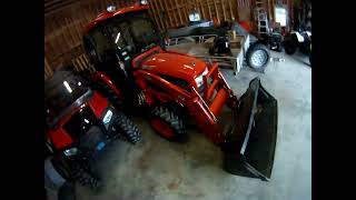 Kioti tractor bucket to move wood.