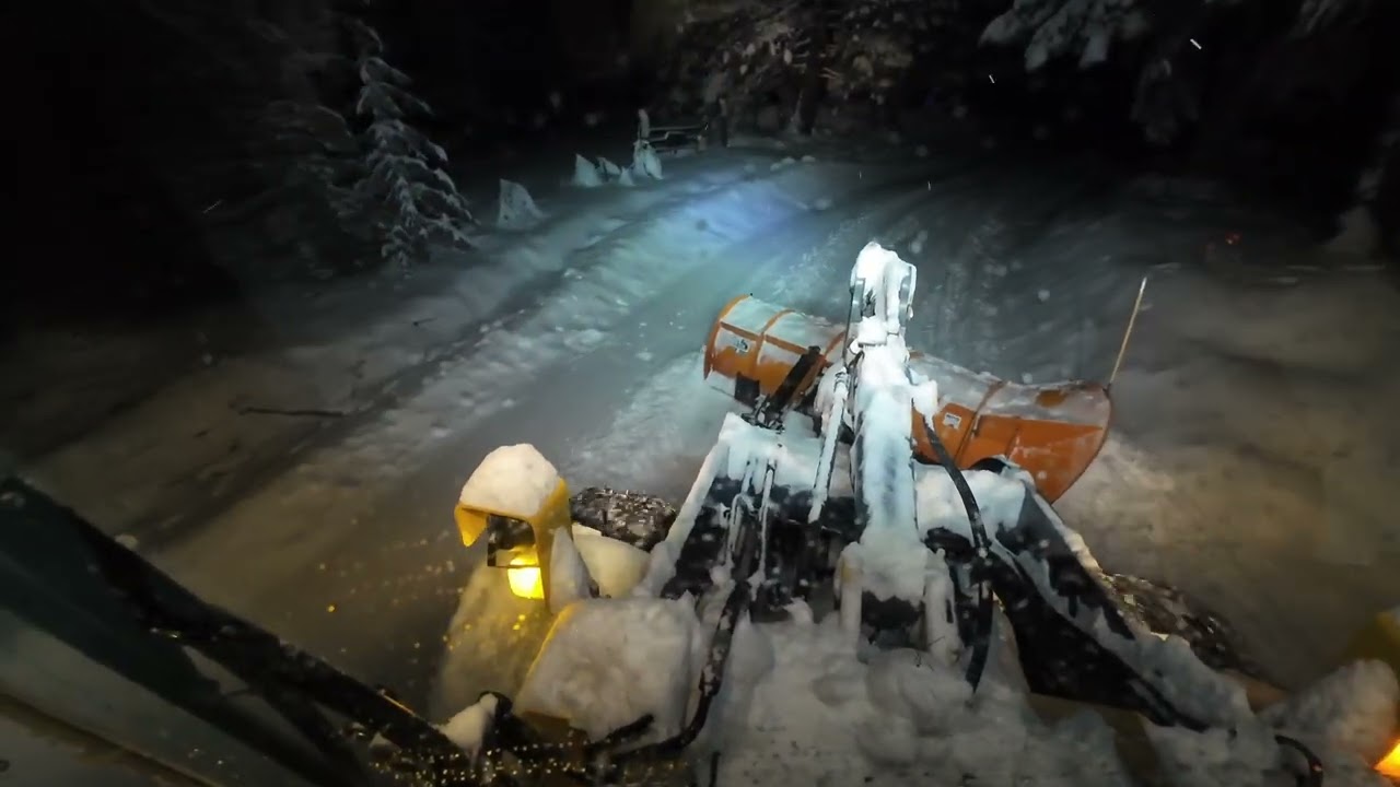Early Morning Snowplow in the Dark.  It keeps snowing!