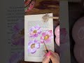 acrylic flowers on the pages of a book #abstractart #youtubrshorts #artshorts