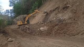 EXCAVATOR 320 GC CATERPILLAR side sloping EXCAVATION excavating hard rocks