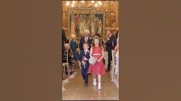 bride and groom walk up the aisle