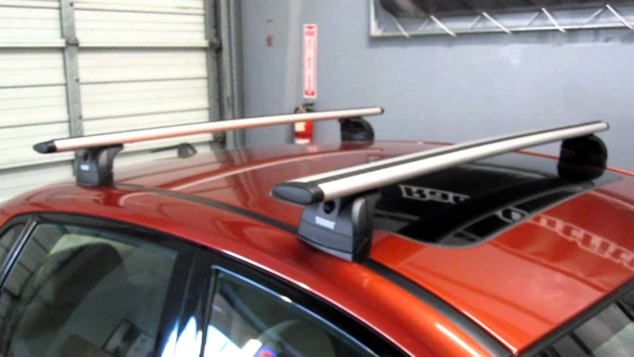 Subaru Impreza Sedan with Thule 460R Podium AeroBlade Roof Rack by Rack