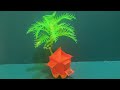 diy kubo with coconut tree made out of tecycled bottle