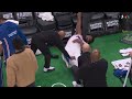 Joel Embiid gets stretched out by the Sixers medical staff
