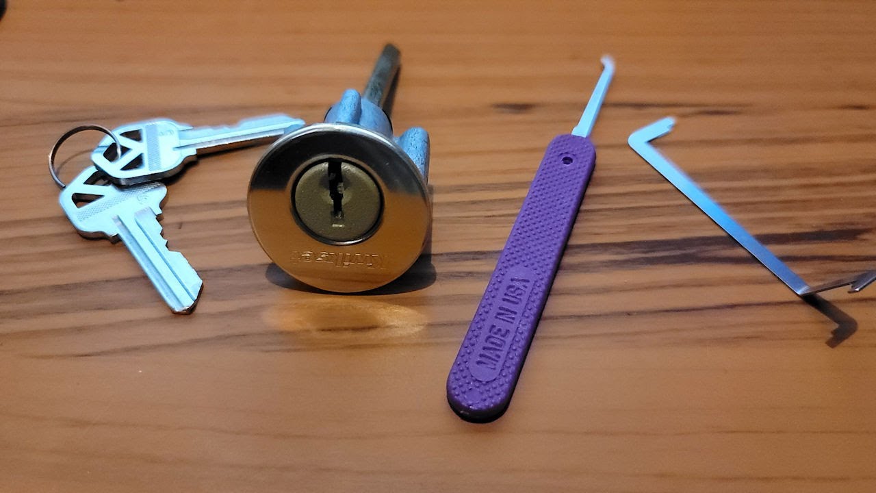 Kwikset 660 deadbolt single pin picking technique with half-diamond pick