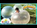 Ryan plays with giant wubble bubble ball