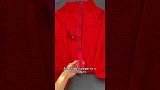 Attaching a zipper to a cardigan.