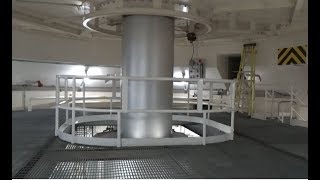 View of spinning shaft of a hydroelectric turbine deep inside Bonneville dam