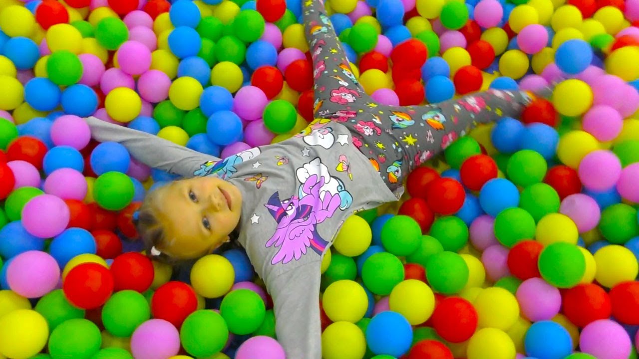 Yasya plays kids musical instrument and climbs rock Video for Kids