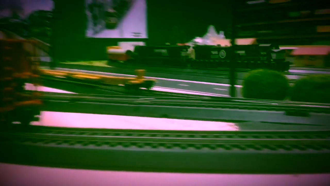 NS 9251, and 8667 pull a train of old coal hoppers going to the scrapyard and some extra freight.