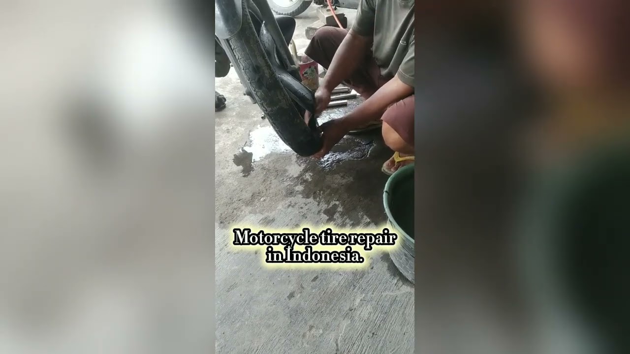 Motorcycle tire repair in Indonesia. 