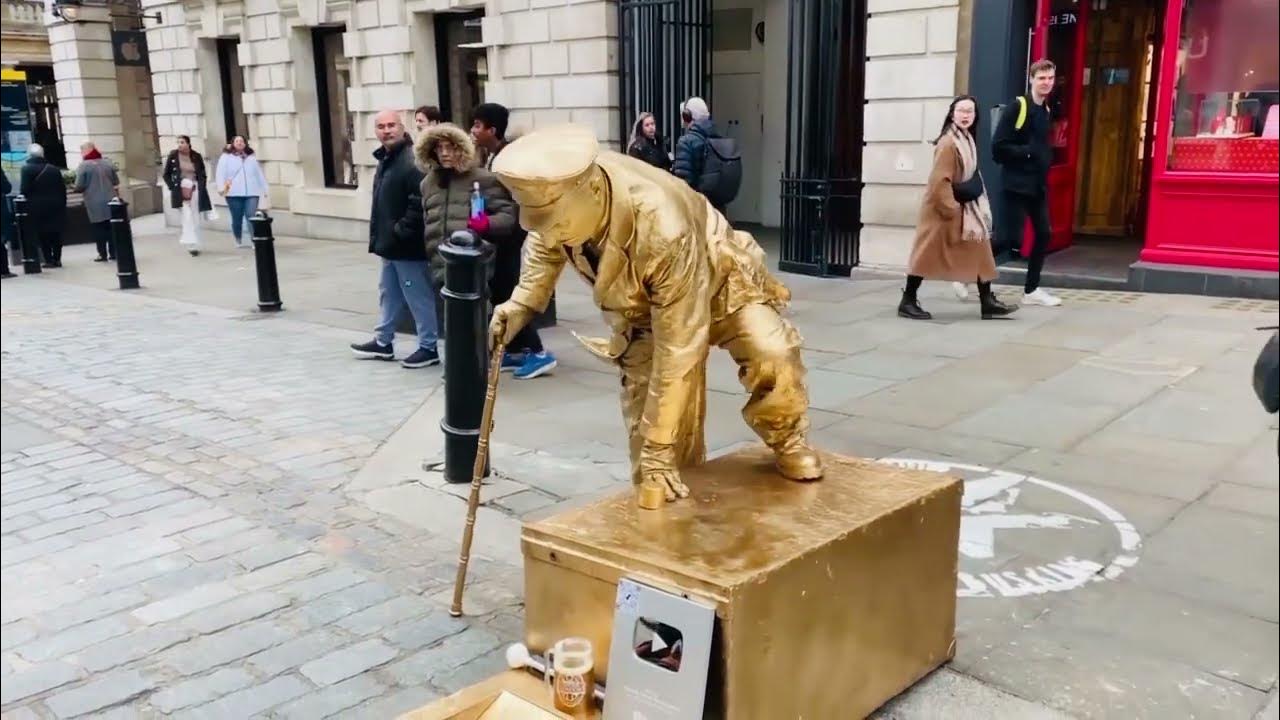 golden-man-statue-secret-revealed-sitting-down-on-nothing-trick