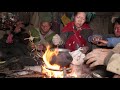 Cooking buff meat in traditional way and eating by village family
