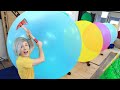 Robby tries How Many Giant Balloons Stops A Throwing Axe?