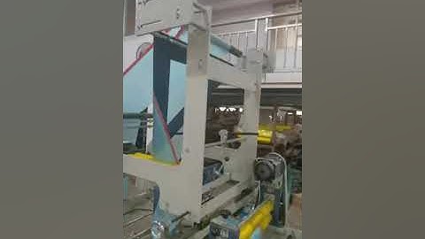 Fully automatic draw tape garbage bag making machine