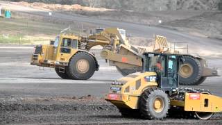 CAT 651E's Scrapers running fill