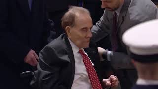 Bob Dole salutes former president George H.W. Bush