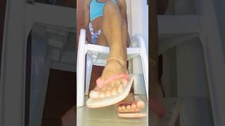 African Nigerian Girl Cross Leg Dangling Flip Flops Sitting Pretty