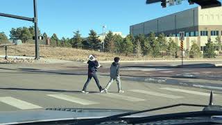 Boy trips over friends hoverboard as they cross street