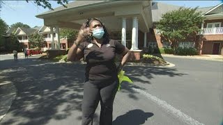 Senior living facility brings families together with drive-by parade