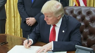 President donald trump signed his first executive order as president,
ordering federal agencies to ease the burden of barack obama's
sweeping healt...