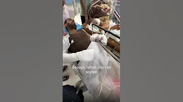 “Don’t be scared, father” - A moment between a Palestinian boy and his father in Gaza hospital