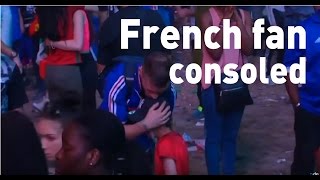 Distraught French fan gets hug from Portuguese boy at Euros