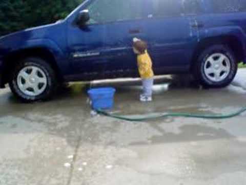 Travis washing the car