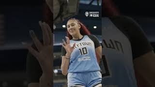 A usually shy Kamilla Cardoso waving to a sideline camera