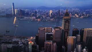 Kowloon skyline at twilight. Dusk illuminates Kowloon with glowing towers and harbor scenery