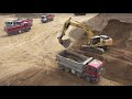 *Holbra DRON* Komatsu 360 nakládá sklápěčky Man