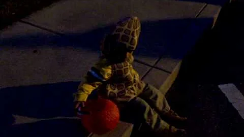 Peanut Punk in all his Peanut cuteness sitting on the curb