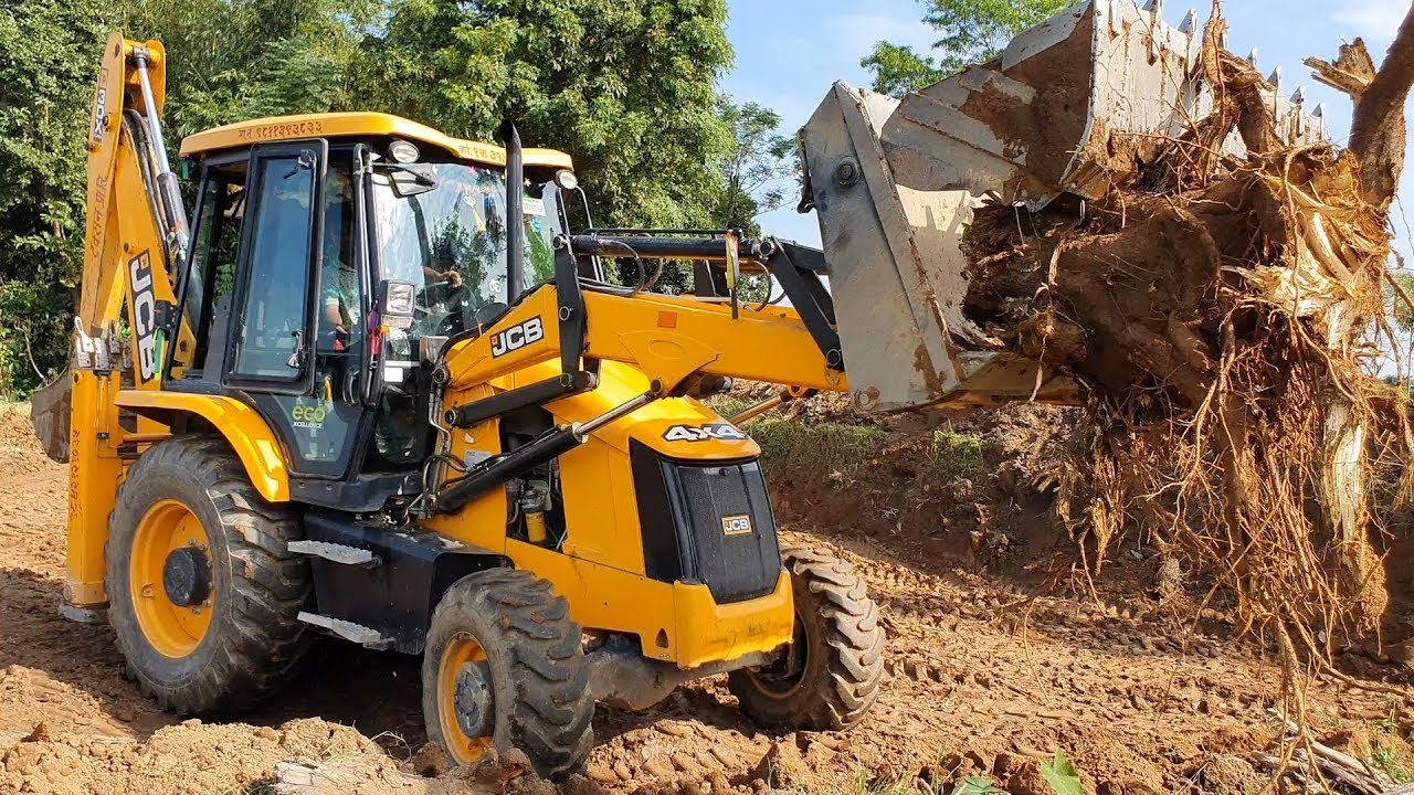 JCB Backhoe Pulling Out Underground Tree Root JCB Working on Mud