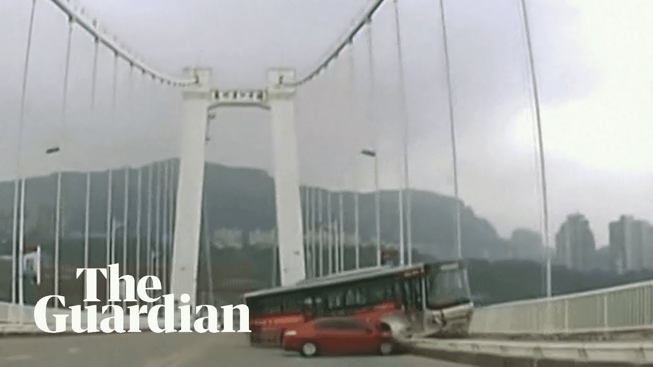 Bus careers off bridge in China as driver and passenger fight - YouTube