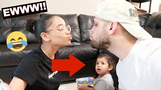 Kissing in front of our 1 year old son to see how he reacts... *Hilarious Reaction*