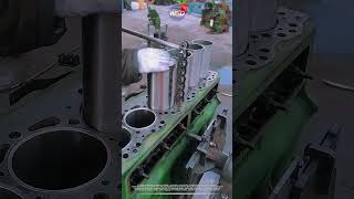 Clever mechanic presses engine cylinder liner using chain tool for heavy diesel repair