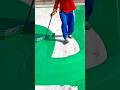 Spreading Green Epoxy Coating Evenly on Concrete for a Smooth Finish #shorts